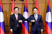 Phó Thủ tướng, Bộ trưởng Ngoại giao Phạm Bình Minh và Bộ trưởng Ngoại giao Lào Saleumsay Kommasith.