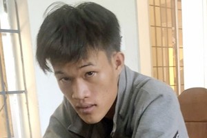 Phạm Kim Phê sau khi bị bắt.