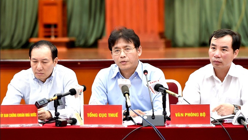 Ông Đặng Ngọc Minh - Phó Tổng cục trưởng Tổng cục Thuế trả lời báo chí tại cuộc họp báo