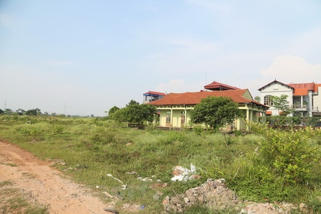 Đường vào dự án Khu biệt thự nhà vườn Nhung Nga (Mê Linh, Hà Nội). (Ảnh: Nguyễn Thắng/Vietnam+)