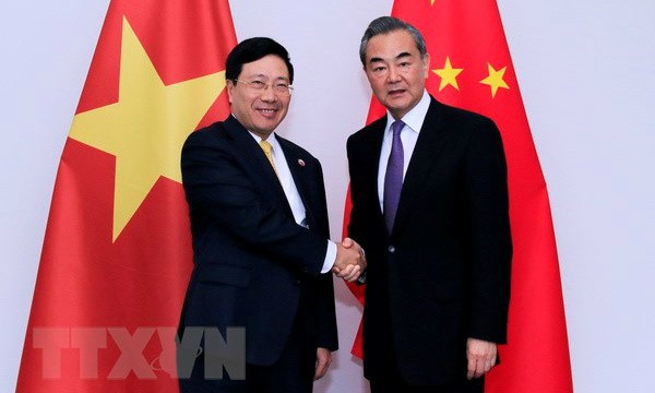 Phó Thủ tướng, Bộ trưởng Ngoại giao Phạm Bình Minh gặp Bộ trưởng Ngoại giao Trung Quốc Vương Nghị. (Ảnh: Phạm Kiên/TTXVN)