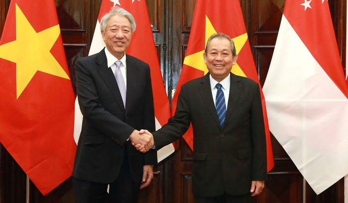 Phó Thủ tướng Thường trực Chính phủ Trương Hòa Bình và Phó Thủ tướng Singapore Tiêu Chí Hiền - Ảnh: VGP