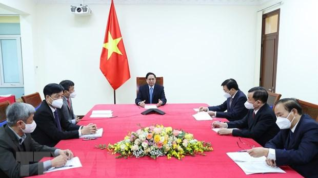 Thủ tướng Phạm Minh Chính điện đàm với Thủ tướng Trung Quốc Lý Khắc Cường. (Ảnh: Dương Giang/TTXVN)