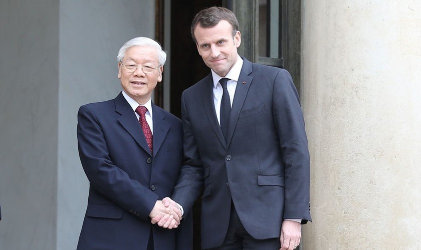 Tổng Bí thư Nguyễn Phú Trọng và Tổng thống Emmanuel Macron. Ảnh: TTXVN