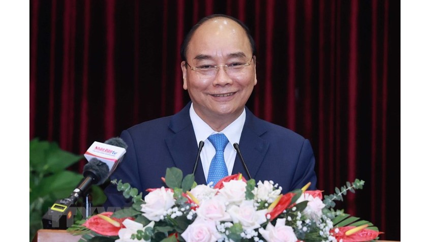 Chủ tịch nước Nguyễn Xuân Phúc: Đà Nẵng là thành phố trung tâm của miền Trung. Đà Nẵng - Quảng Nam là đầu tàu tăng trưởng của miền Trung và là cực tăng trưởng quan trọng của cả nước. Ảnh: TTXVN
