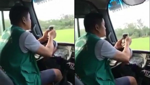 Hình ảnh nam tài xế dùng khuỷu tay lái xe.