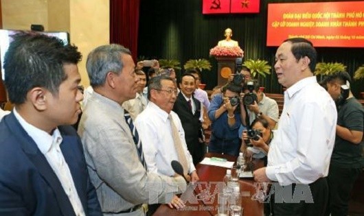 Chủ tịch nước Trần Đại Quang cùng Đoàn đại biểu Quốc hội Thành phố gặp gỡ các doanh nghiệp, doanh nhân Thành phố Hồ Chí Minh. (Ảnh: Nhan Sáng-TTXVN)