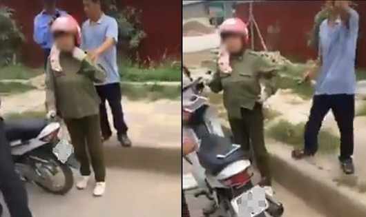 Người dân vây bắt người phụ nữ đi xe máy vì nghi bắt cóc trẻ em (Ảnh cắt từ clip)