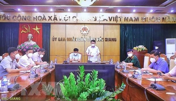 Lãnh đạo và các đại biểu tỉnh Bắc Giang dự họp trực tuyến. Ảnh: Nguyễn Điệp/TTXVN