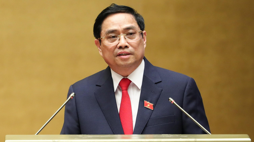 Thủ tướng Chính phủ Phạm Minh Chính trình bày Tờ trình về cơ cấu số lượng thành viên Chính phủ khóa XV. Ảnh: VGP/Nhật Bắc