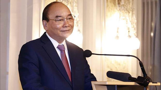 Chủ tịch nước Nguyễn Xuân Phúc phát biểu tại cuộc gặp gỡ với doanh nghiệp hai nước, tối 26/11/2021 (giờ địa phương).