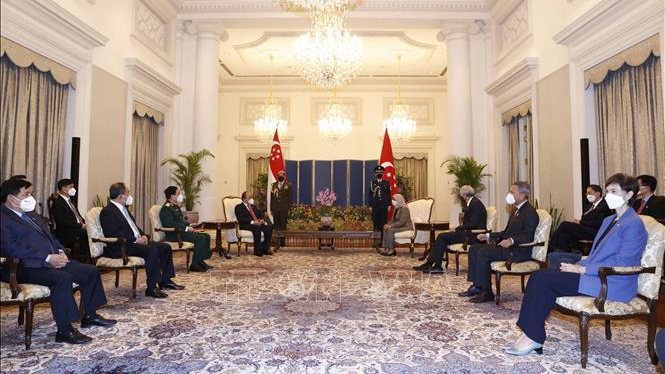 Chủ tịch nước Nguyễn Xuân Phúc hội đàm với Tổng thống Cộng hòa Singapore Halimah Yacob. Ảnh: Thống Nhất/TTXVN