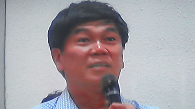 Ông Trần Đình Long đối chất tại phiên tòa - Ảnh chụp qua màn hình