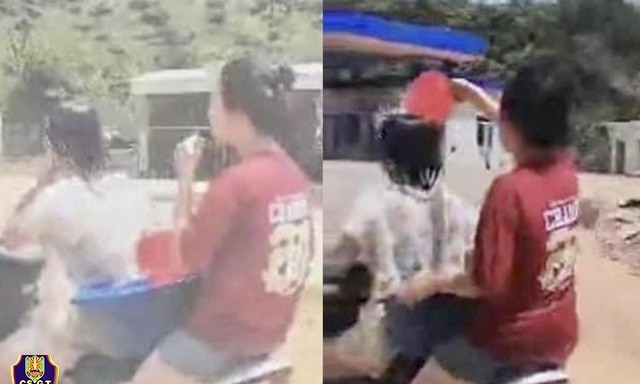 Hình ảnh 2 nữ sinh vừa điều khiển xe máy vừa dội nước cho nhau. Nguồn ảnh CSGT cung cấp 