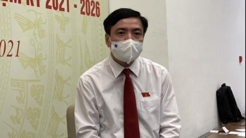 Ông Bùi Văn Cường trả lời phóng viên tại Trung tâm Báo chí Hội đồng Bầu cử Quốc gia chiều 23/5.