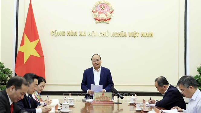 Chủ tịch nước Nguyễn Xuân Phúc chủ trì buổi làm việc. Ảnh: TTXVN