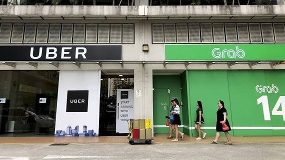 Thương vụ sáp nhập Grab - Uber tại Việt Nam đang có những kết luận trái ngược nhau