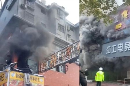 Hiện trường vụ cháy cửa hàng ở thành phố Tân Dư, tỉnh Giang Tây, Trung Quốc, ngày 24/1. Ảnh: Reuters.
