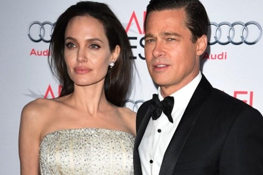 Vợ chồng Angelina Jolie và Brad Pitt tại một sự kiện. 