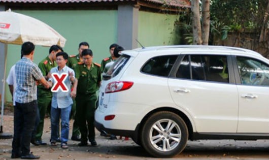 Trần Minh Lợi (x) bị cơ quan điều tra bắt giữ.