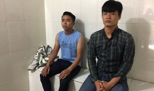 Hai đối tượng Nguyễn Anh Tuấn (trái) và Phạm Hoàng Ngọc Châu tại cơ quan điều tra.